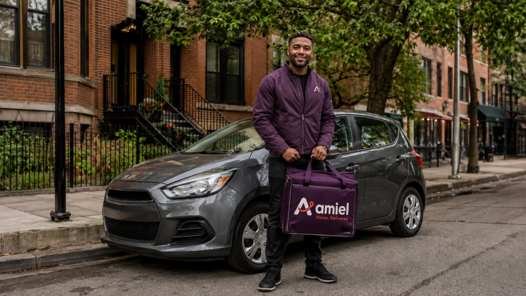 An Amiel delivery driver preparing for a neighborhood delivery